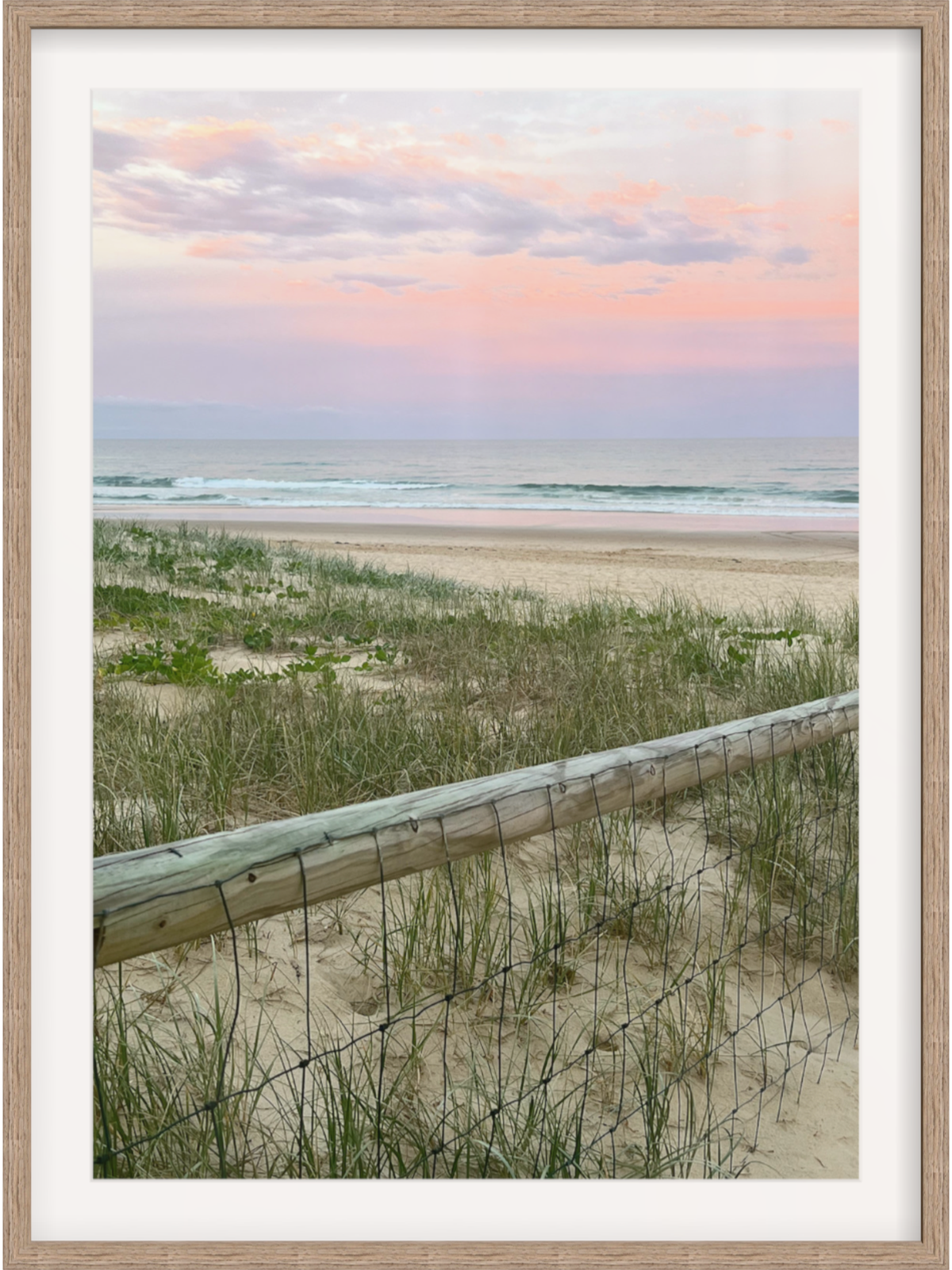 Diagonal wooden fence beach art in light wood frame with white mat border