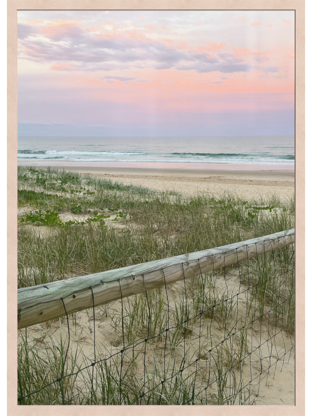 Beach landscape print in light wood frame without matting showing sunset