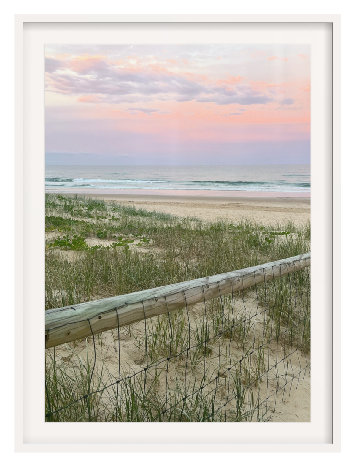 White framed coastal art print with thick mat showing dune grasses
