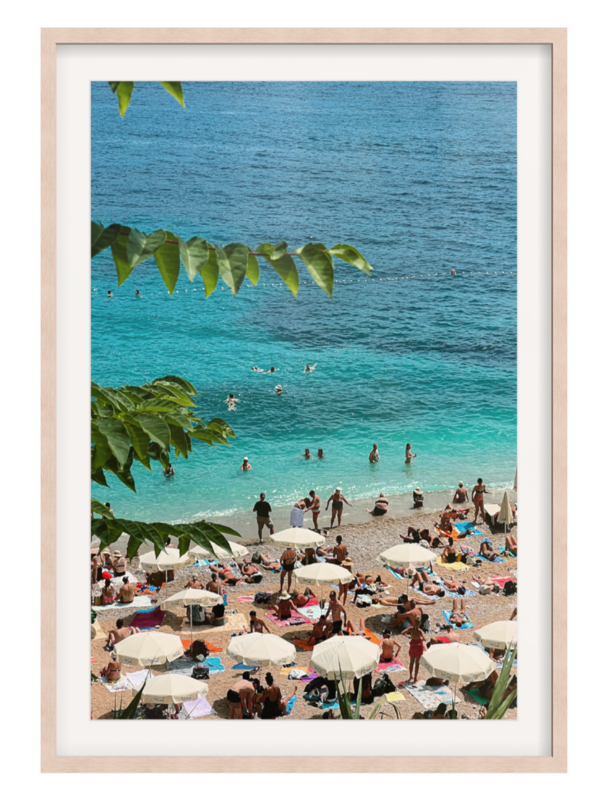 Light Oak with border Framed photograph of a beach scene with people and umbrellas, featuring a clear blue sky and ocean.