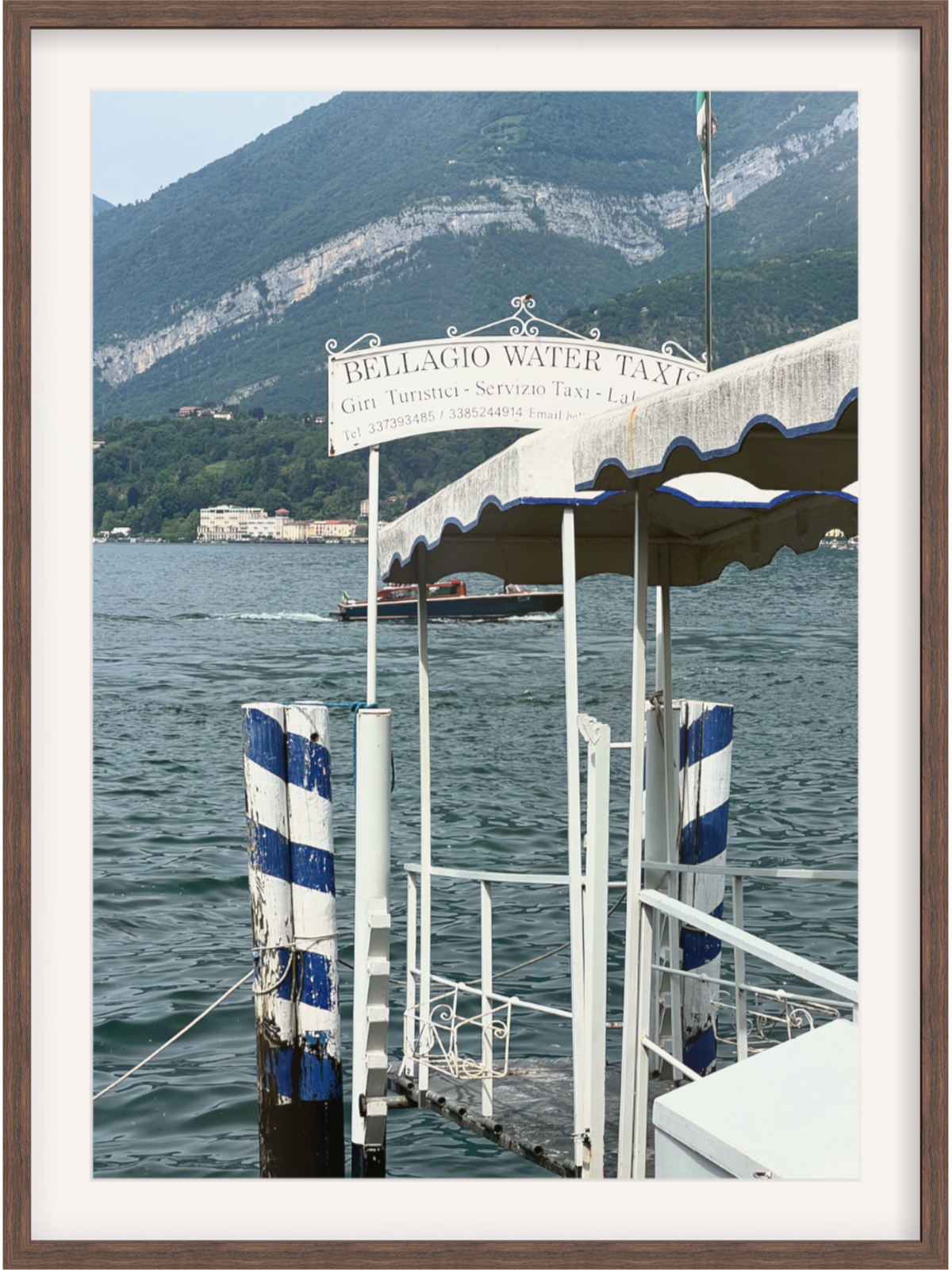 Gallery quality Bellagio waterfront print with wide white mat and dark brown wood border