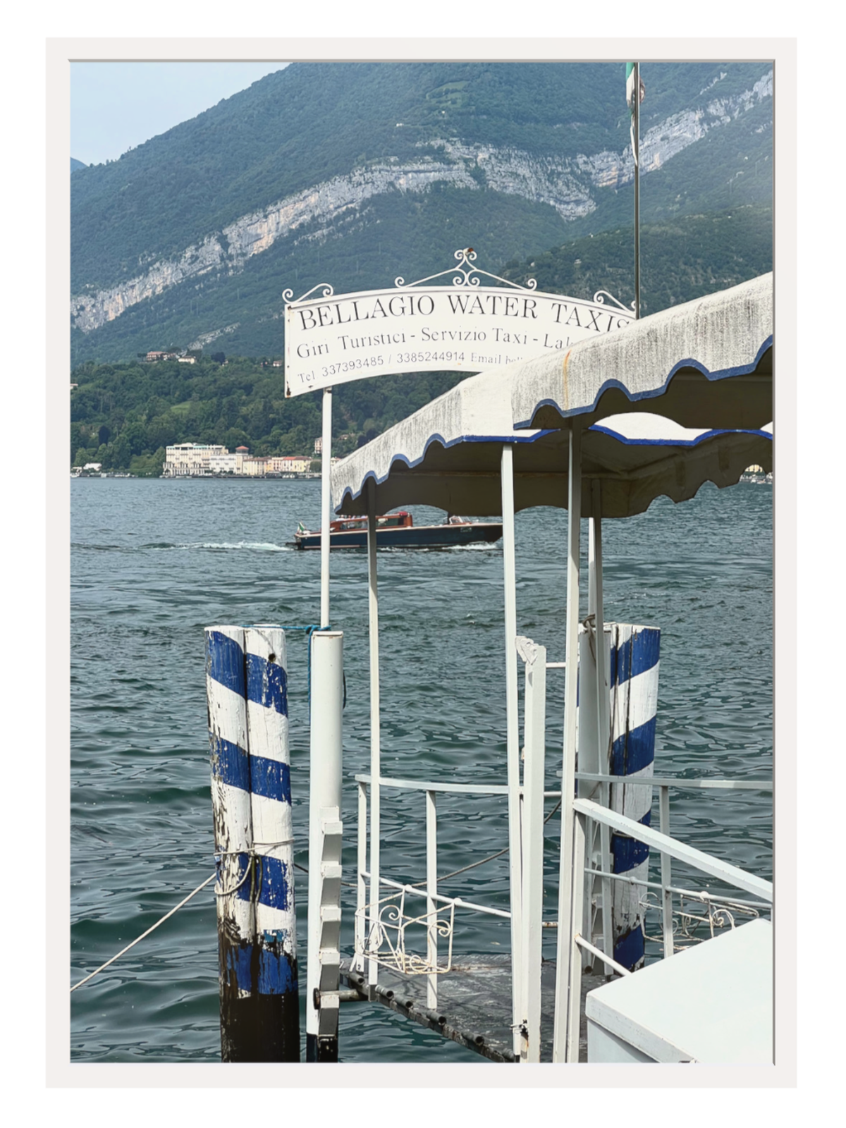 Bellagio Italy wall art print of water taxi and striped dock on Lake Como