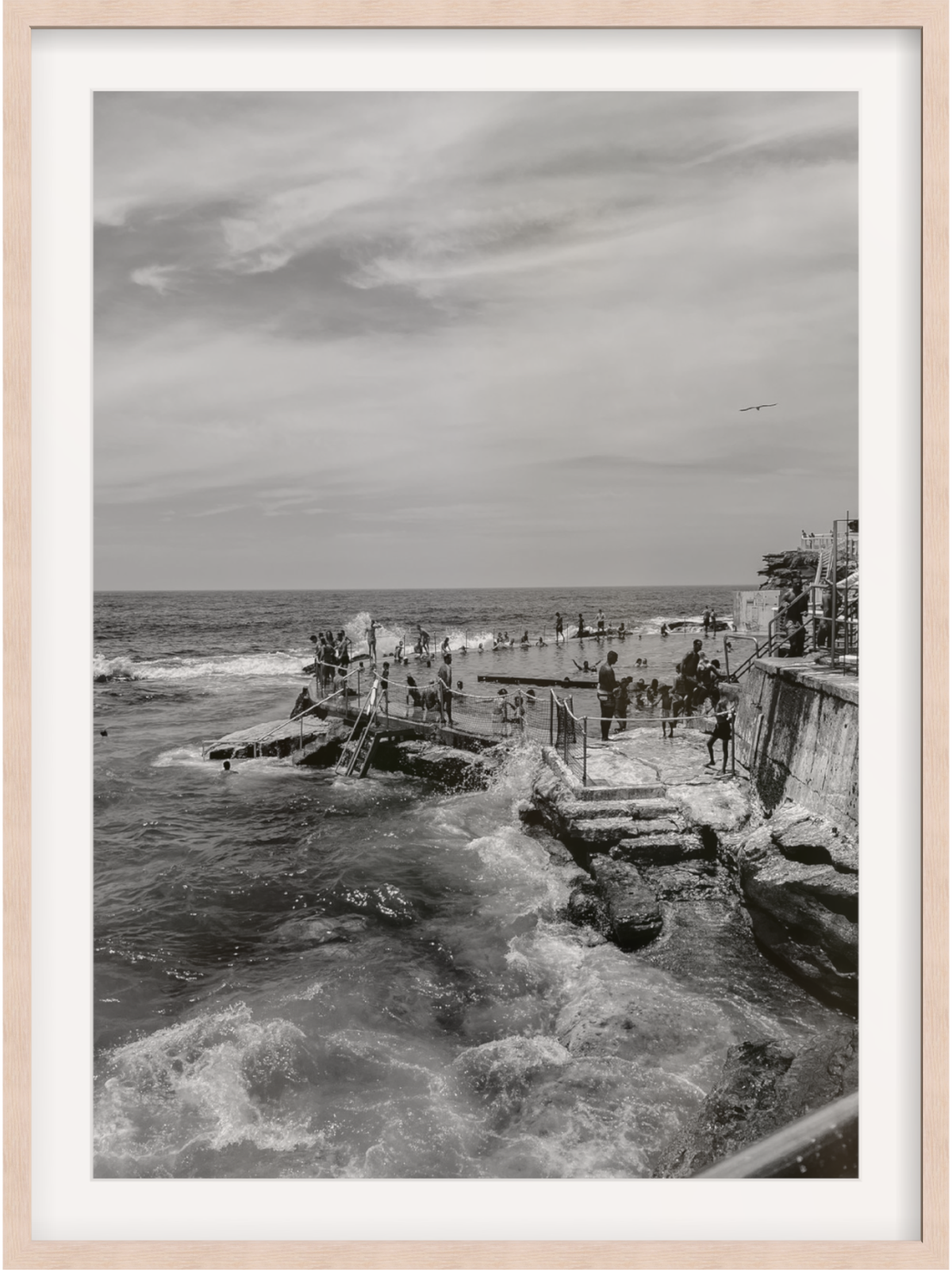 Bronte III B&W ocean bath art with light wood frame and white mat