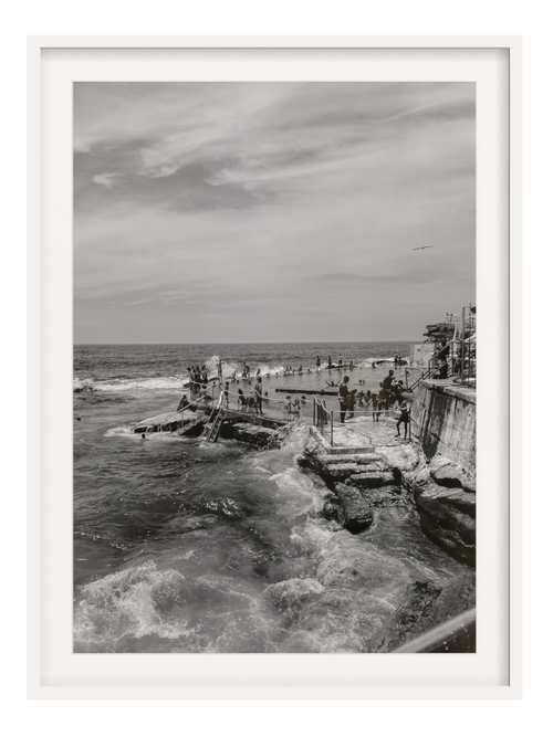 Bronte III B&W ocean bath art in white frame with wide matting