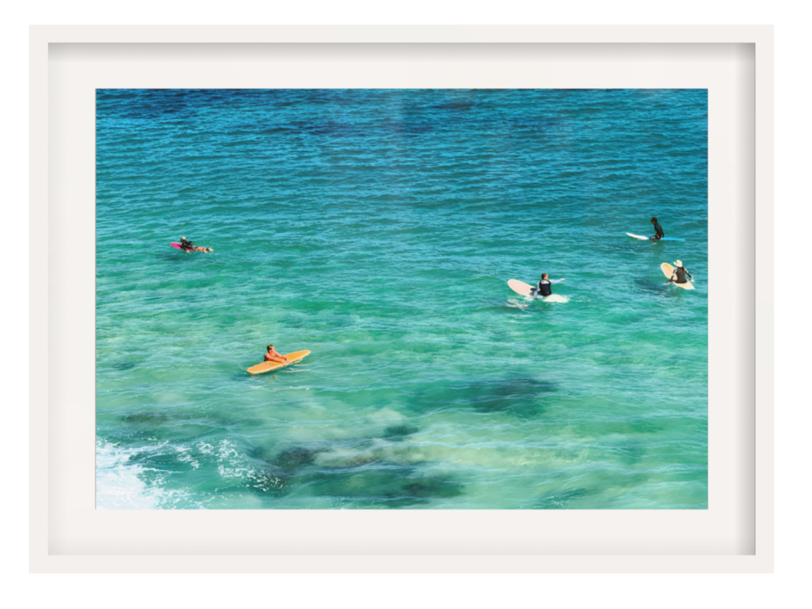 Framed photograph of people swimming in clear blue water