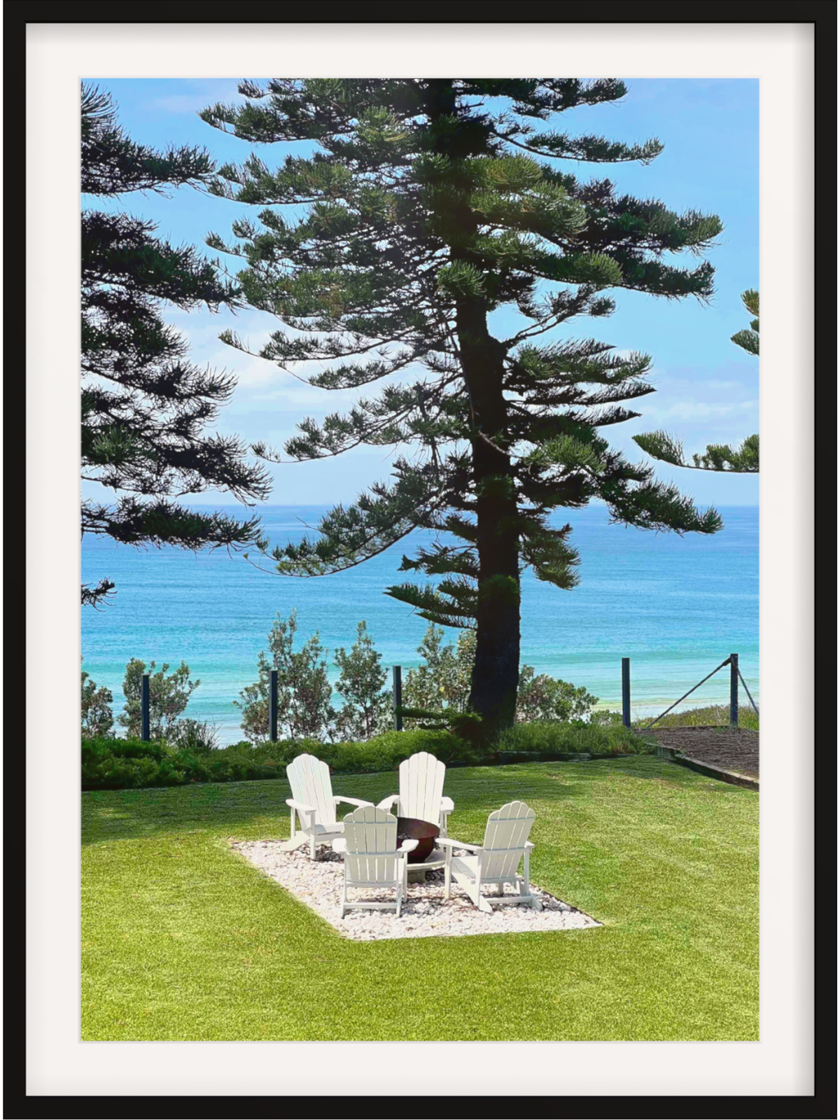 Black framed Culburra Beach House print with wide white mat border