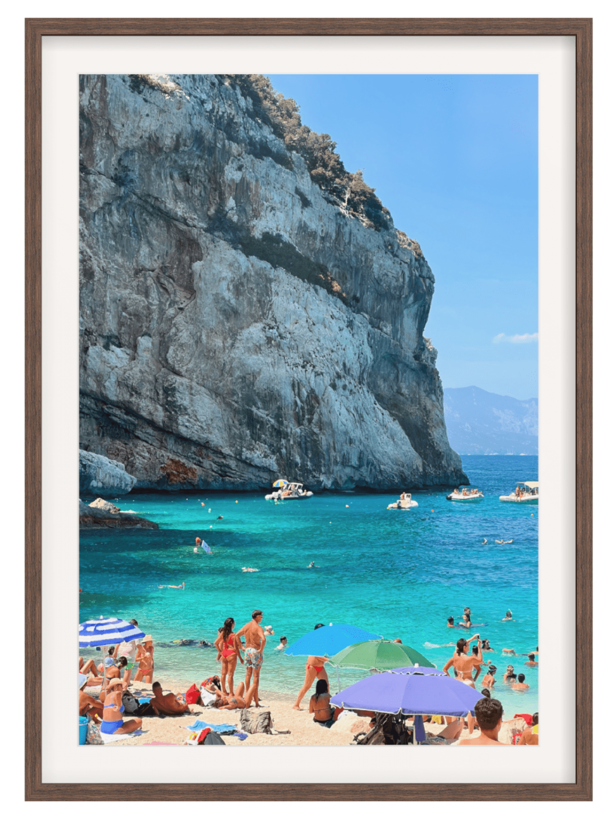 Cala Mariolu framed print in dark brown wood with people swimming under colorful umbrellas