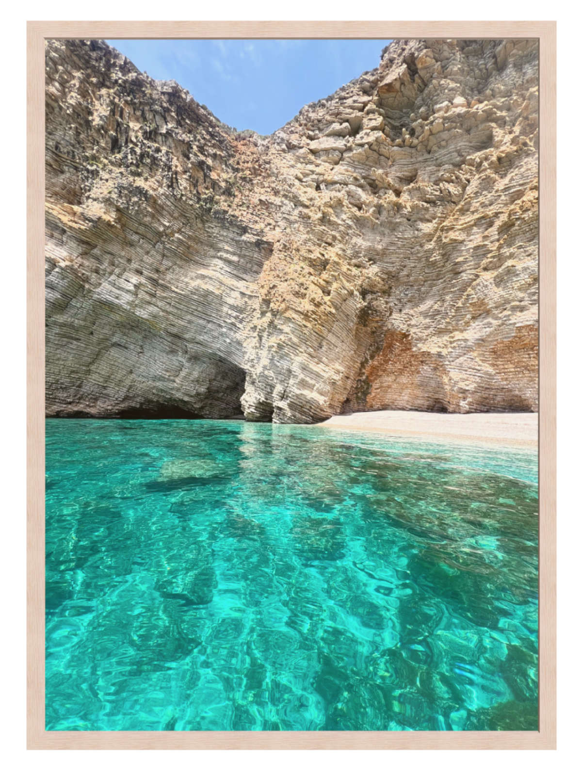 Clear turquoise water and rocky cliffs at a beach