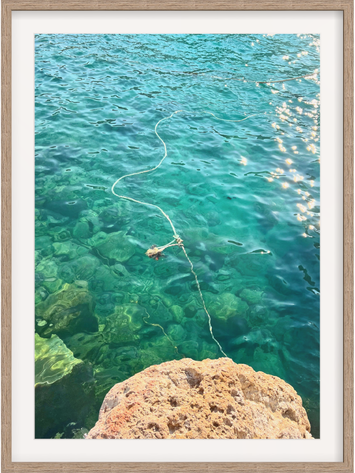 Firopotamos III light wood framed print with sparkling reflections on clear turquoise water