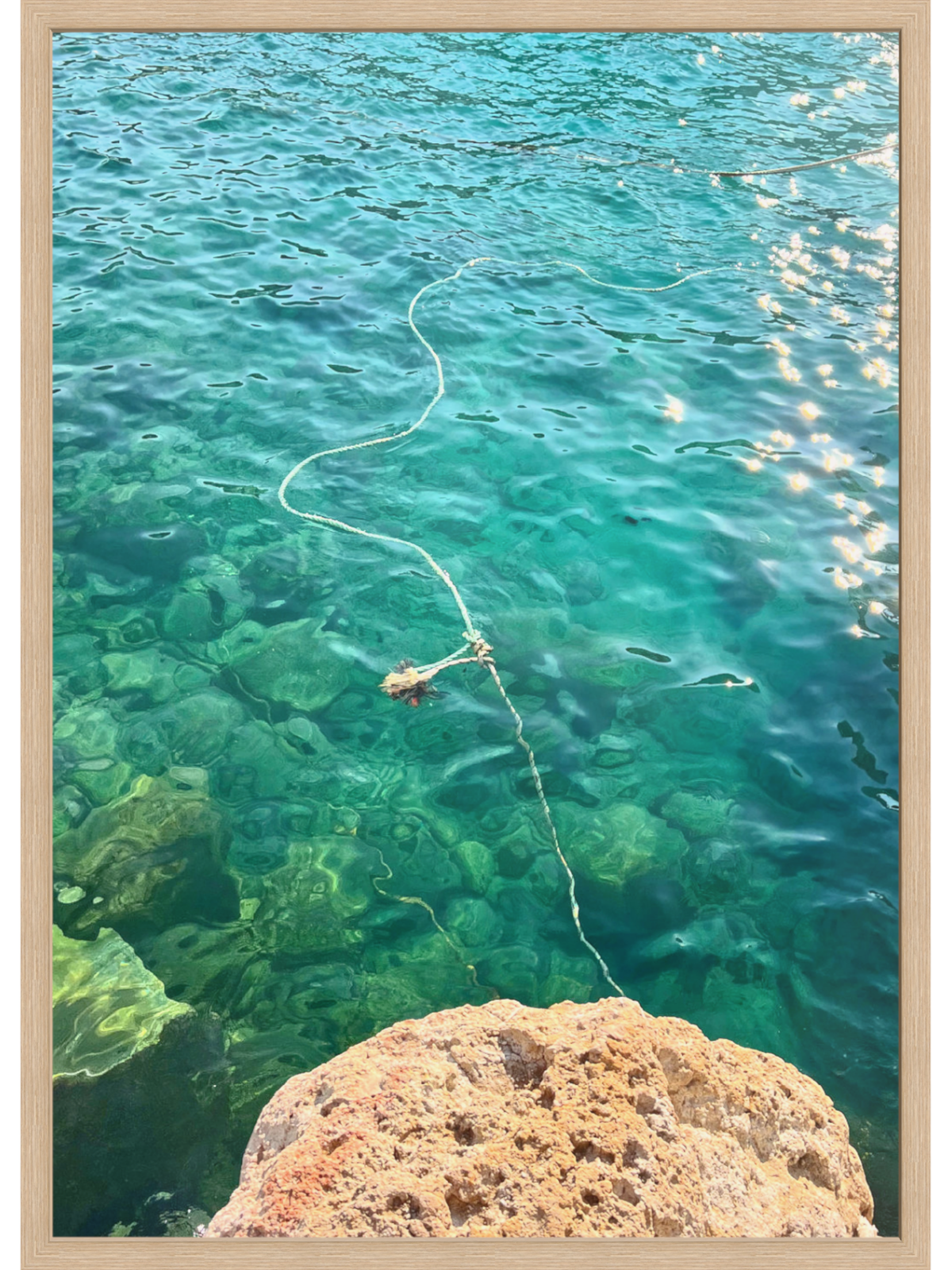 Firopotamos III natural wood framed print emphasizing porous rock and sunlit water clarity