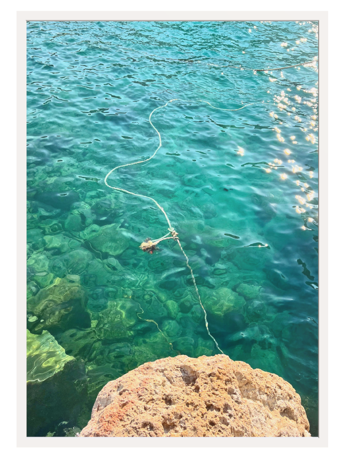 Firopotamos III coastal wall art with off-white mat border showing clear water scene