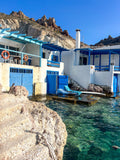 Unframed Firopotamos Milos print with clear turquoise water and white architecture