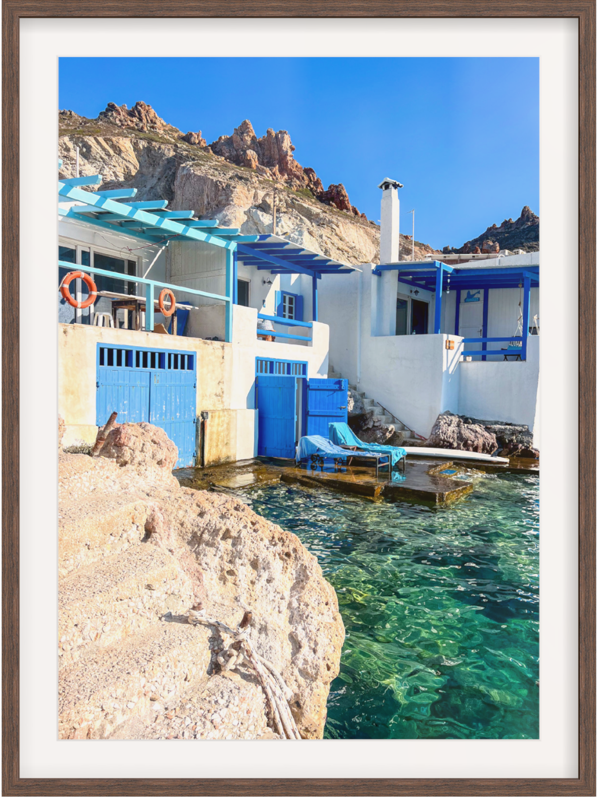 Firopotamos Milos wall art in dark brown frame with vibrant blue and orange details