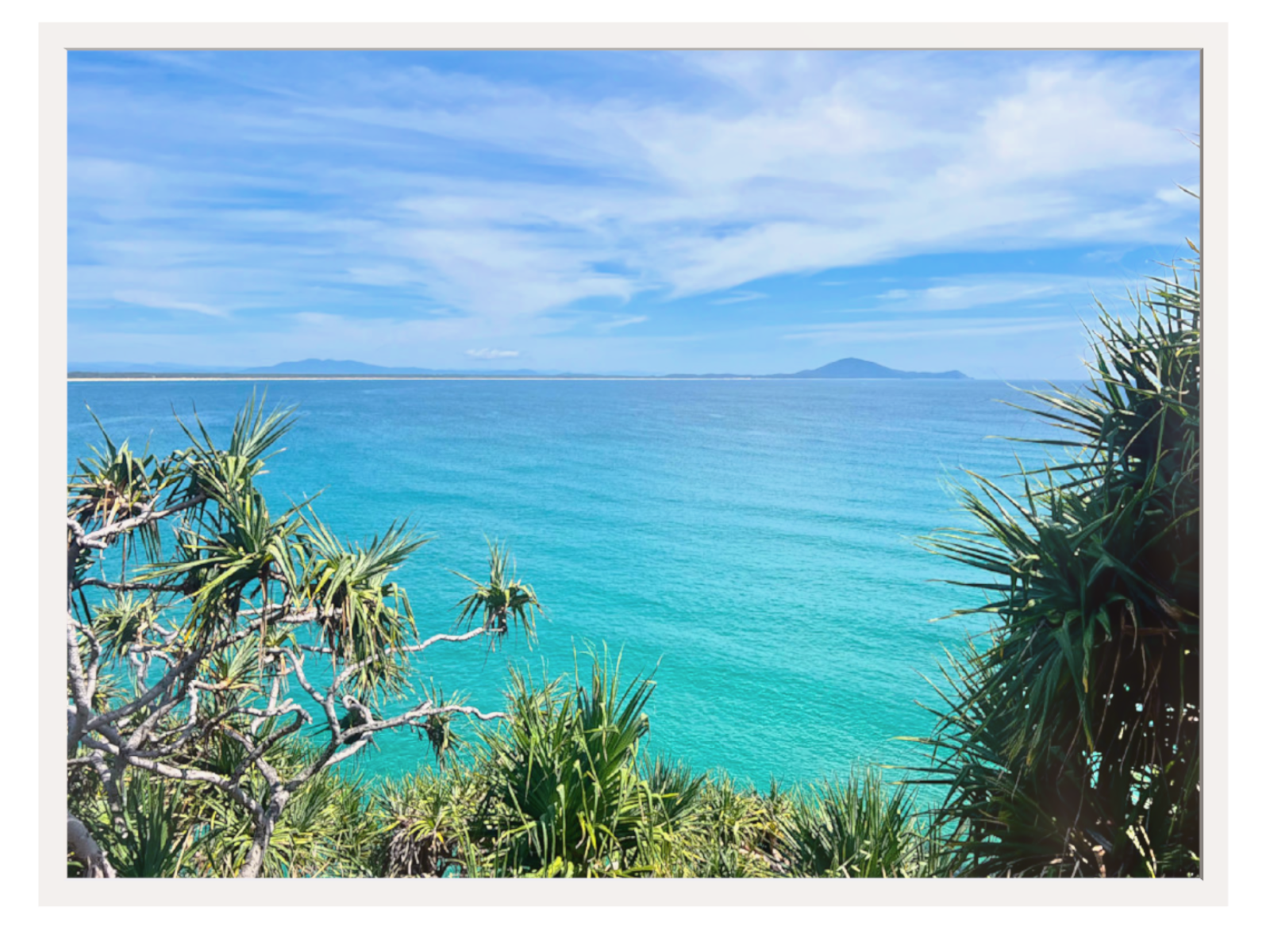 Tropical landscape with turquoise ocean and clear blue sky
