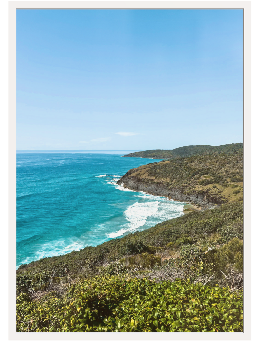 Hat Head Australia wall art print in cream frame with minimal matting displaying rocky headland and surf