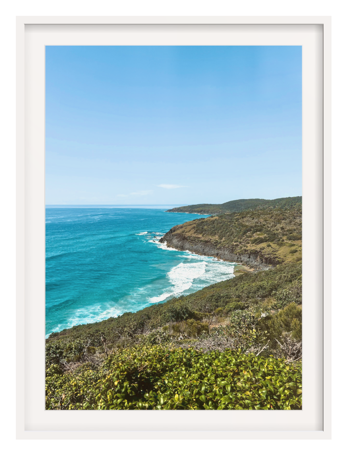 Hat Head Australia beach scene framed wall art in white frame with wide mat showing blue sea and cliffs