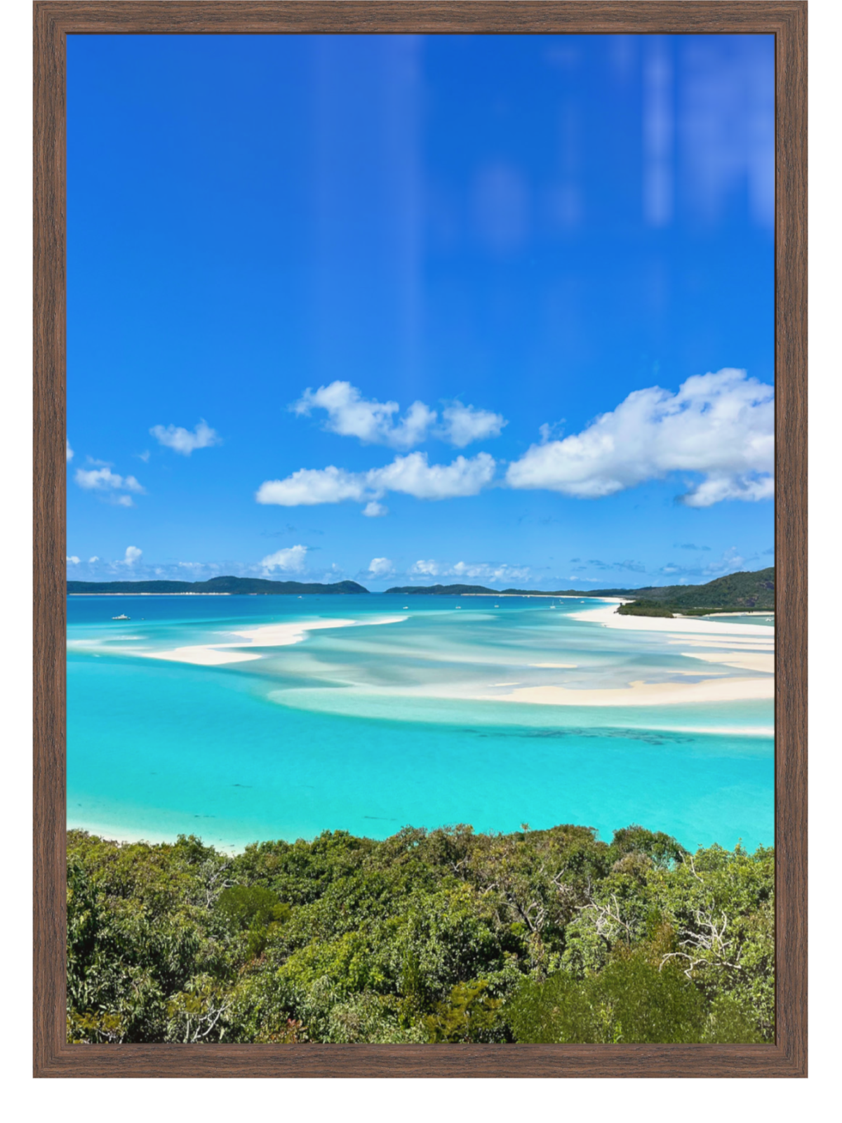 Framed photograph of a tropical beach with turquoise water and blue sky.