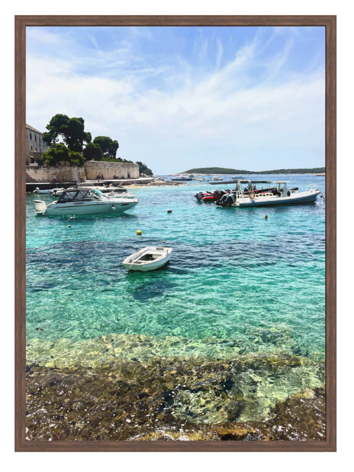 Coastal scene with boats in clear blue water, framed picture