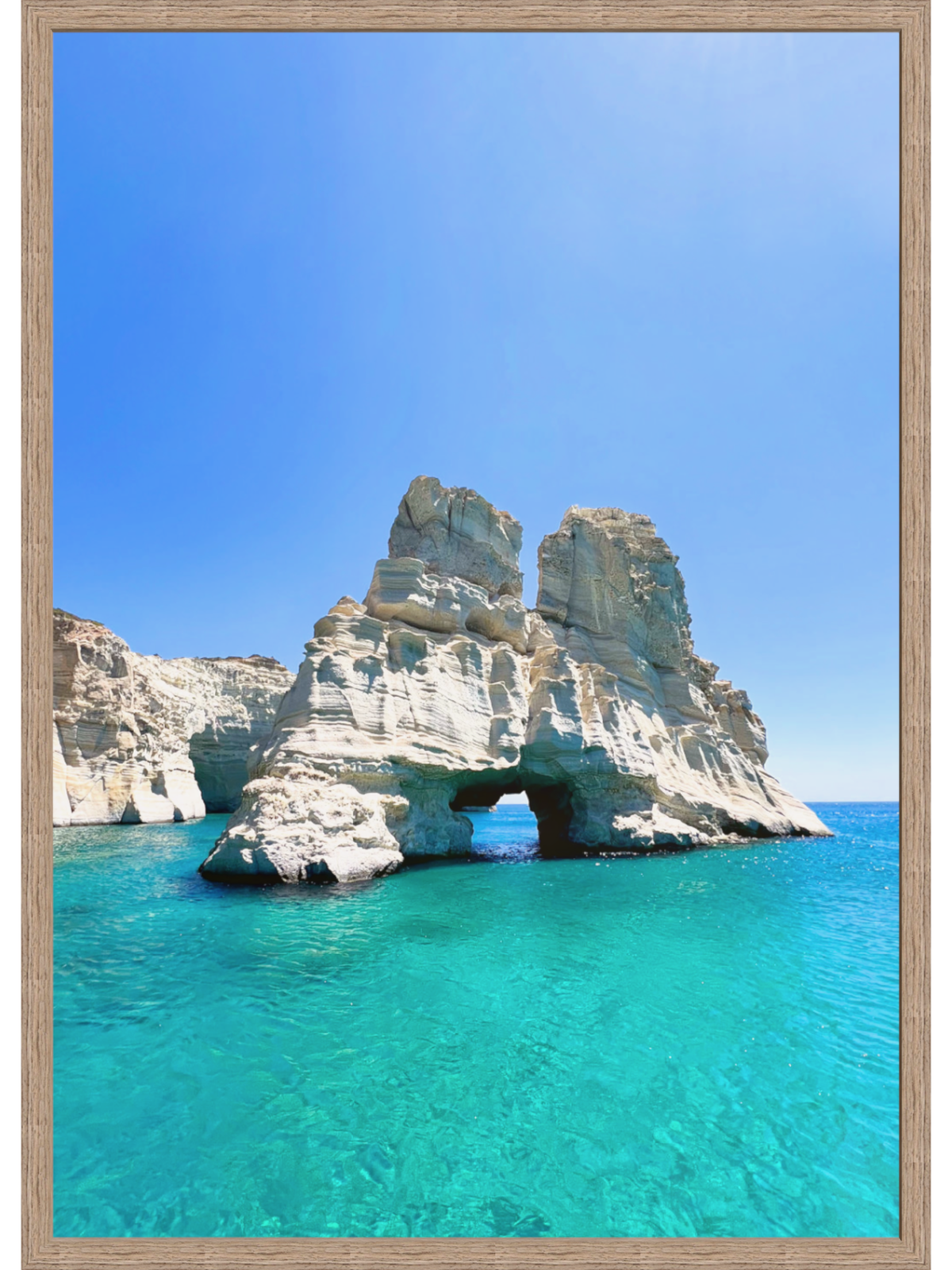 Cave formation in clear blue water with a wooden frame