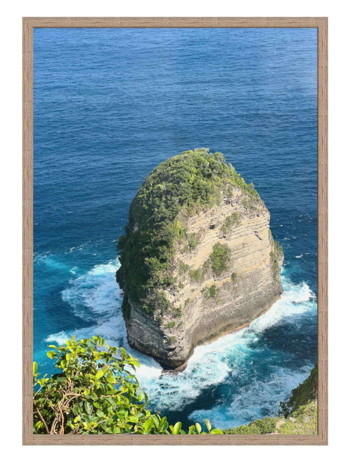 Hazel Framed artwork of a rocky island with ocean waves