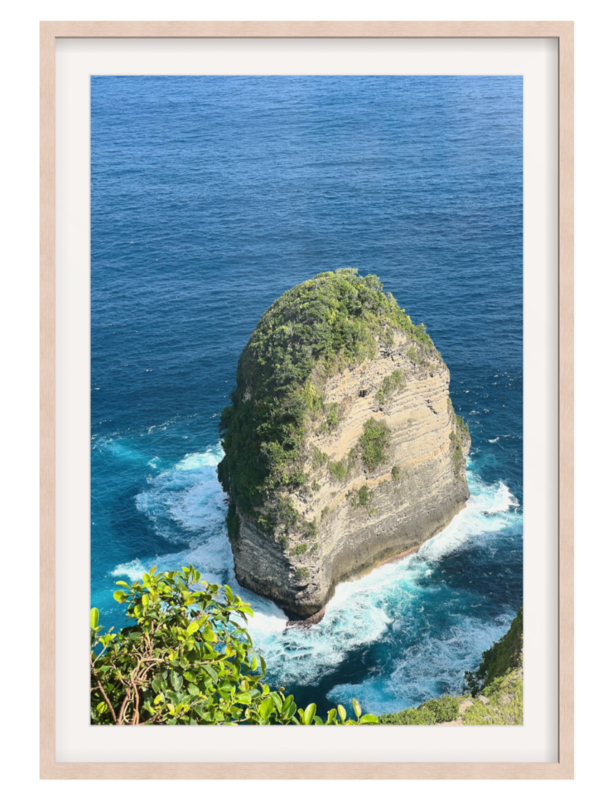 Light Oak Framed photograph of a rocky island with blue ocean and greenery.