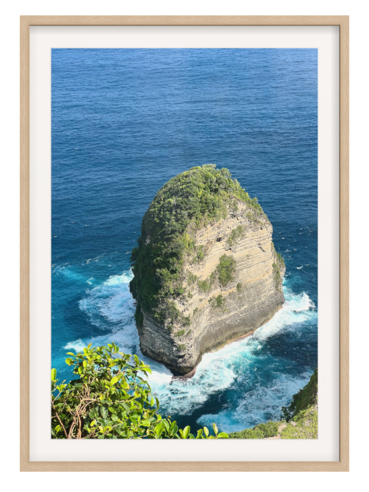 Oak Framed photograph of a rocky island with blue ocean and white waves.