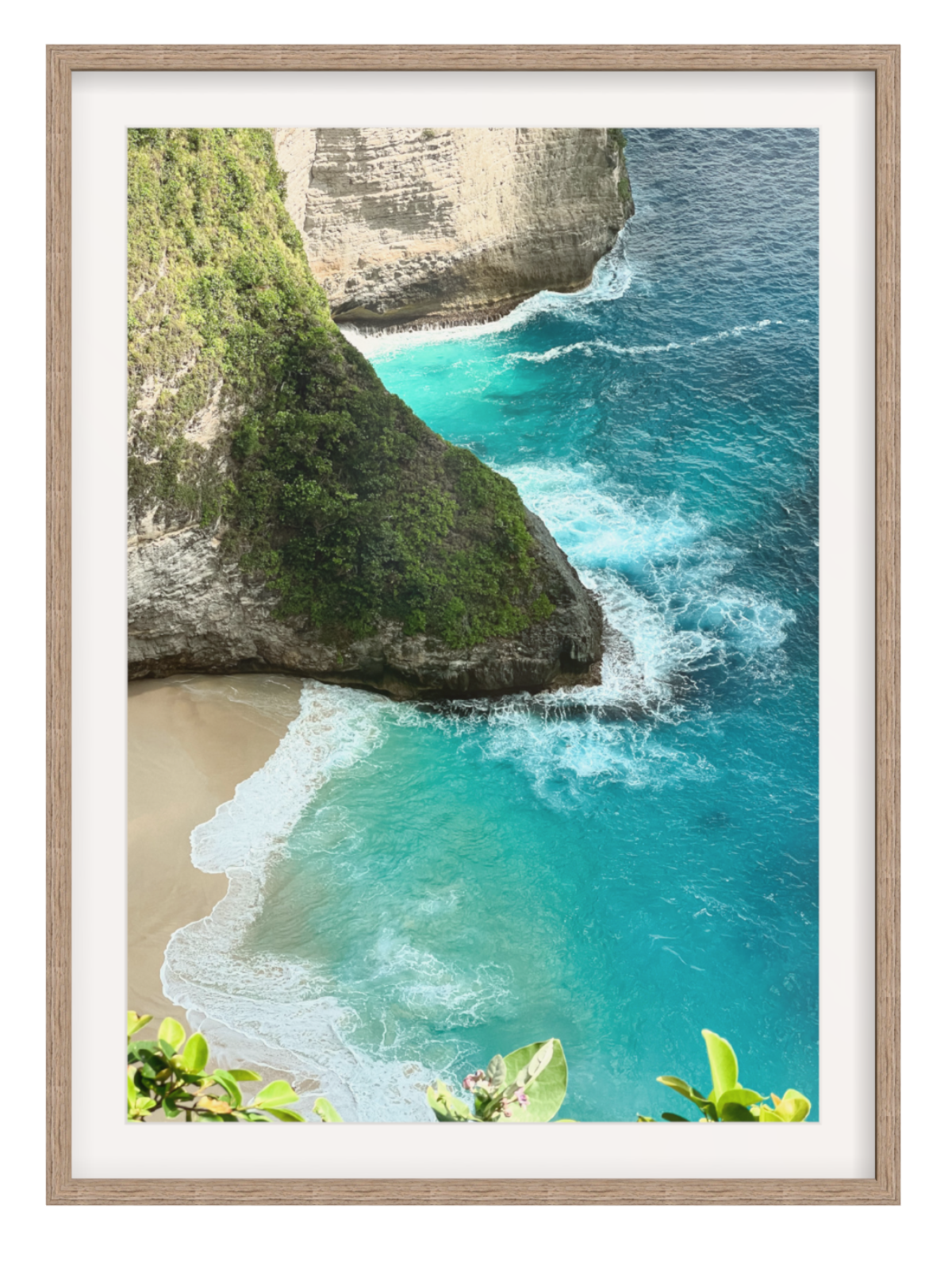 Hazel Framed wih border photograph of a tropical beach with turquoise water and rocky cliffs.