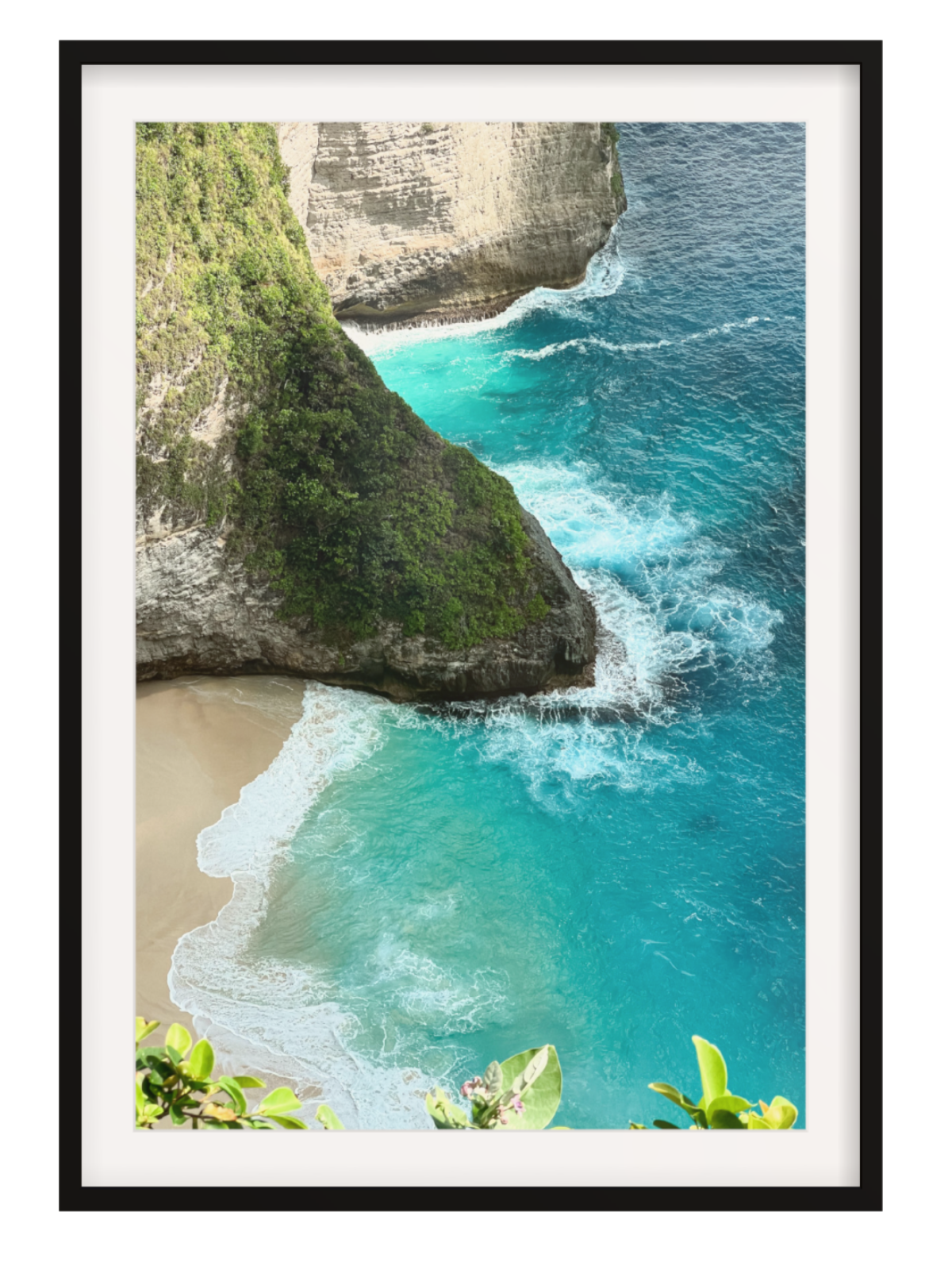 Black border Framed photograph of a tropical beach with turquoise water and cliffs.