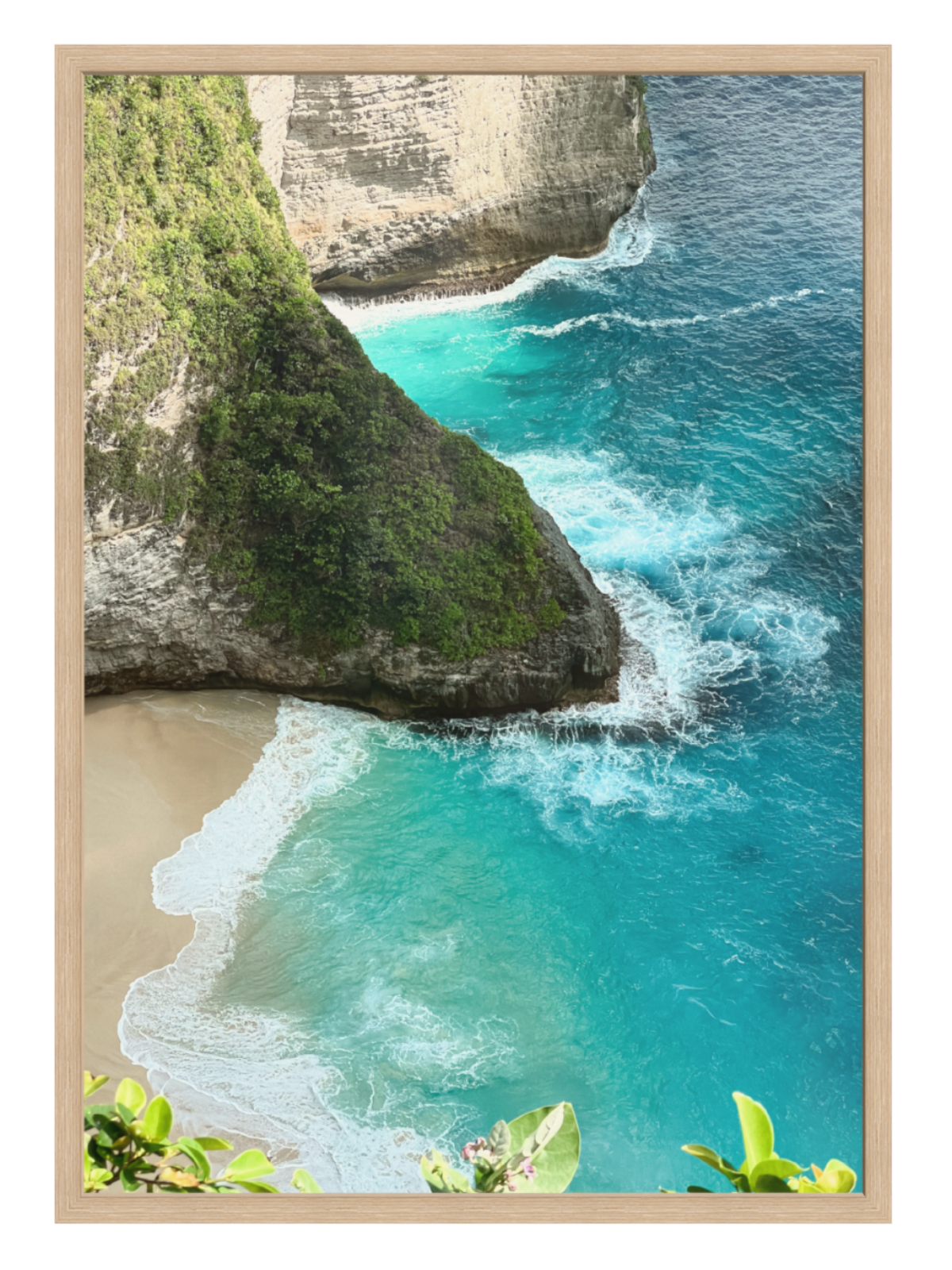 Oak Framed photograph of a beach with turquoise water and cliffs.