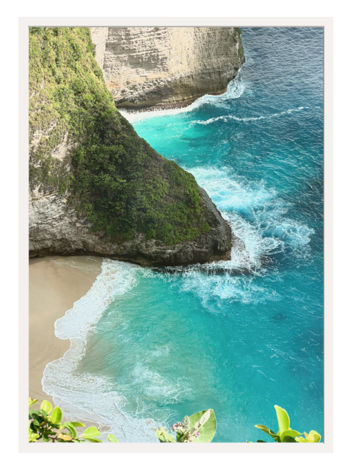 White frame Tropical beach with turquoise water and rocky cliffs