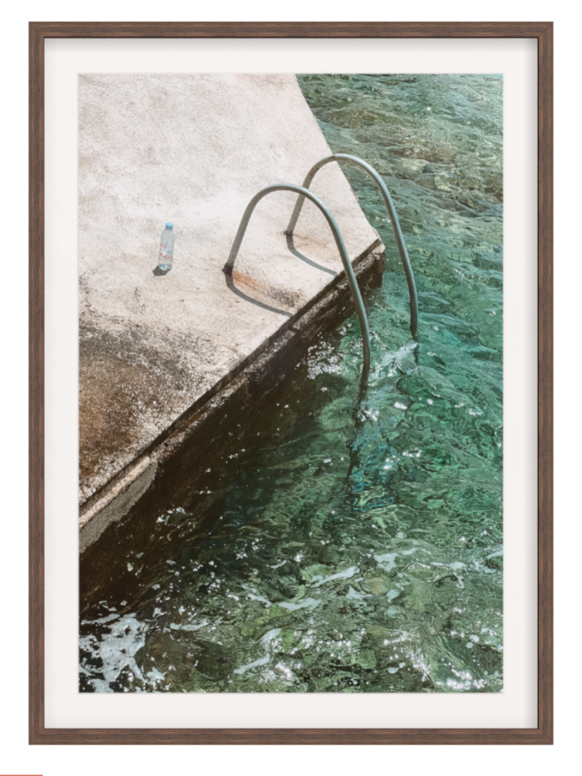 Framed photograph of a dock with a metal railing in a body of water.