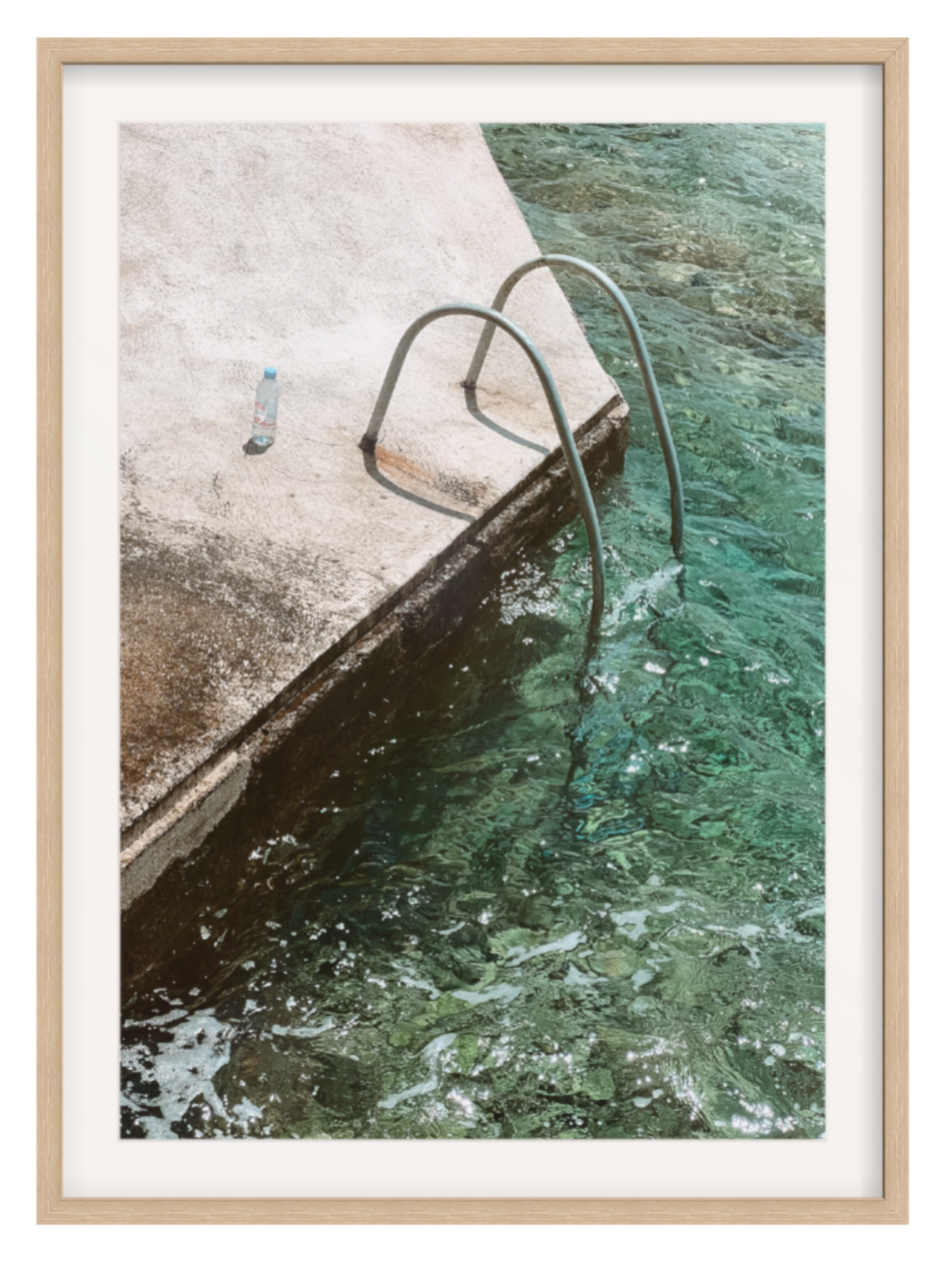 Framed photograph of a pool with a wooden frame
