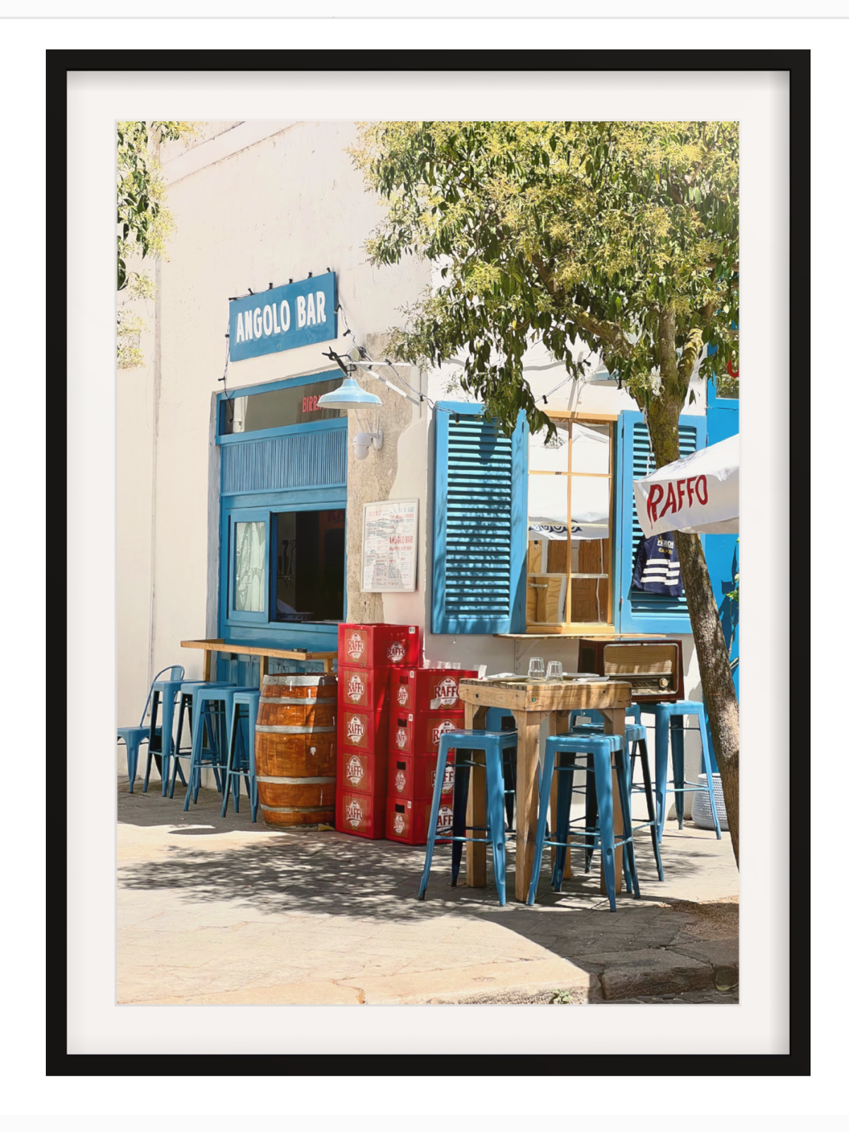 Black frame wide white mat stucco facade blue shutters Raffo crates