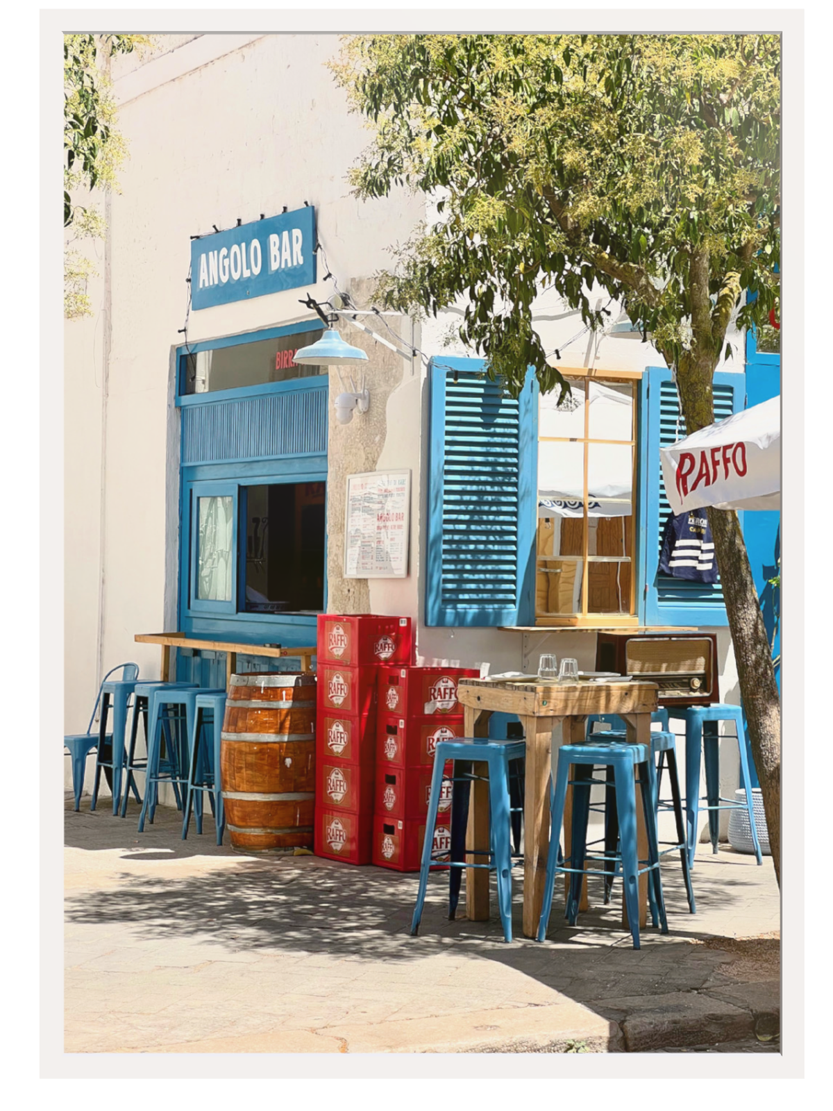 Sunlit Italian alleyway thin white mat light wood frame warm shadows