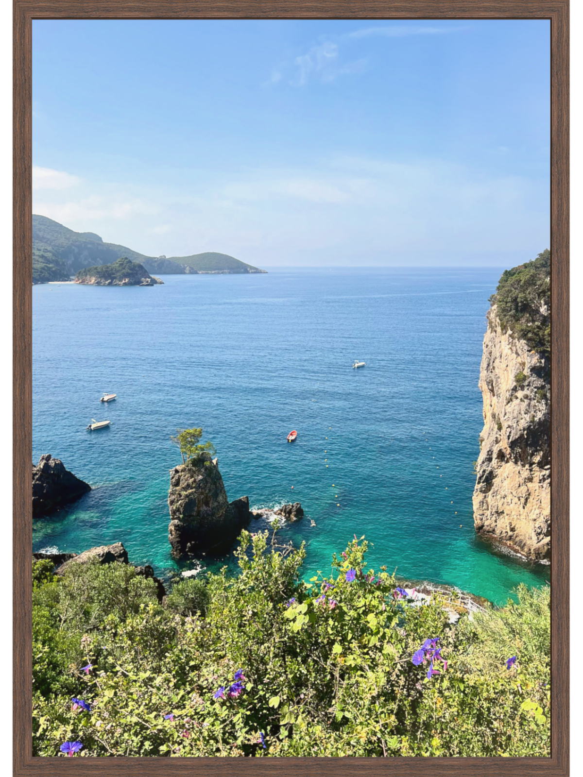 cliffs blue ocean with boats 