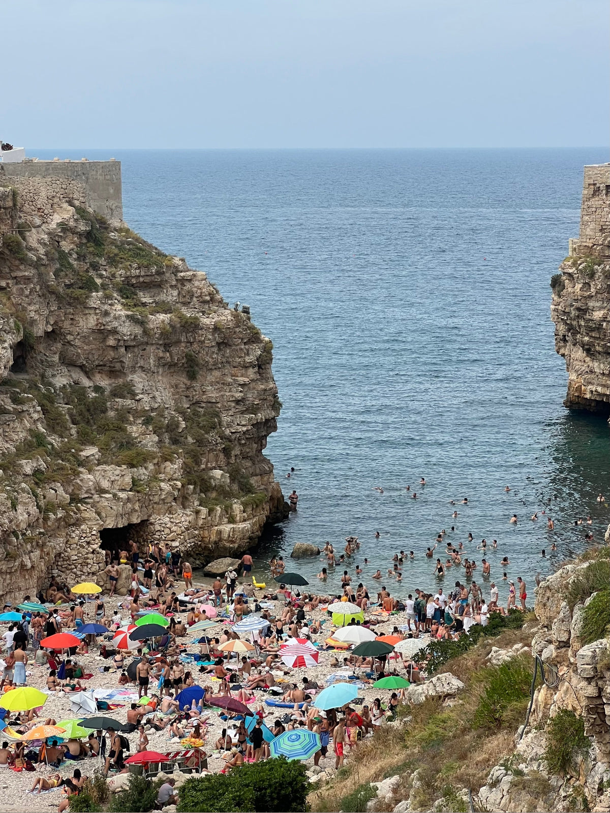 Polignano a Mare Italy coastal view wall art in light wood frame cropped