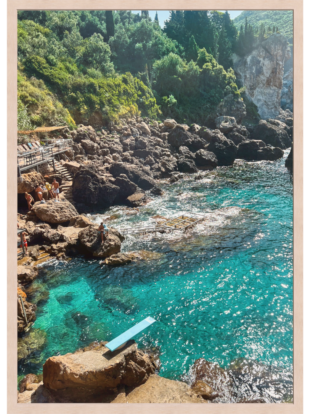 Paleokastritsa Greece coastal wall art print close-up in light wood frame showing rugged rocks