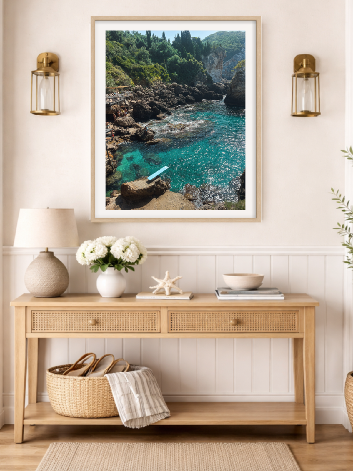 Paleokastritsa Greece coastal wall art hanging above console table in light wood frame home decor
