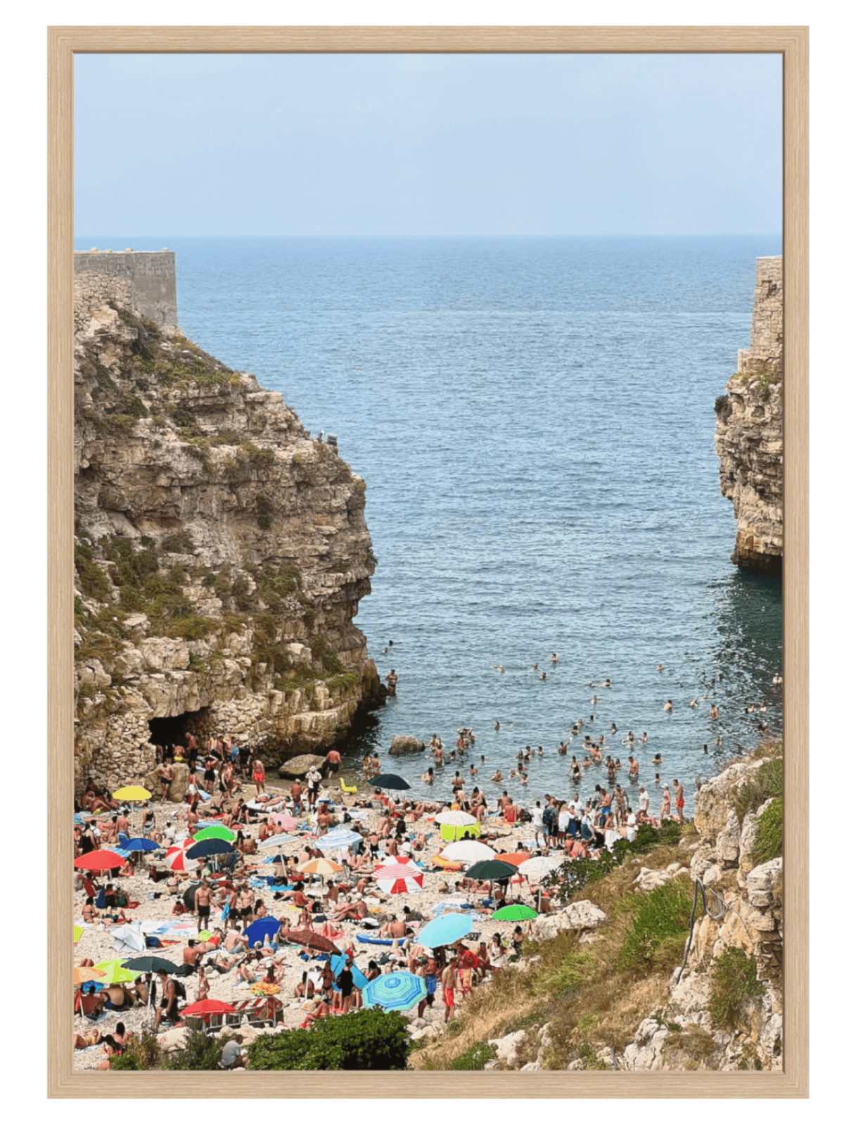Polignano a Mare Italy crowded cove wall art in light wood frame no mat