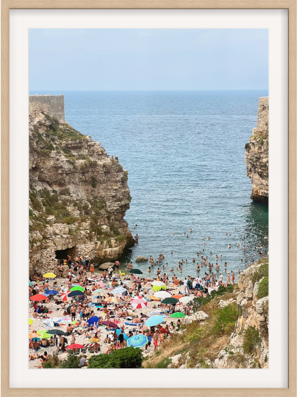 Polignano a Mare Italy elevated beach view wall art in light wood frame