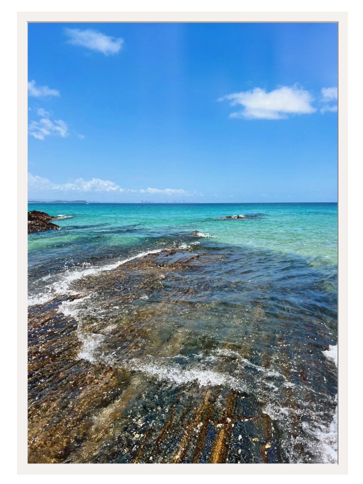 Coastal scene with clear blue water and rocky shoreline