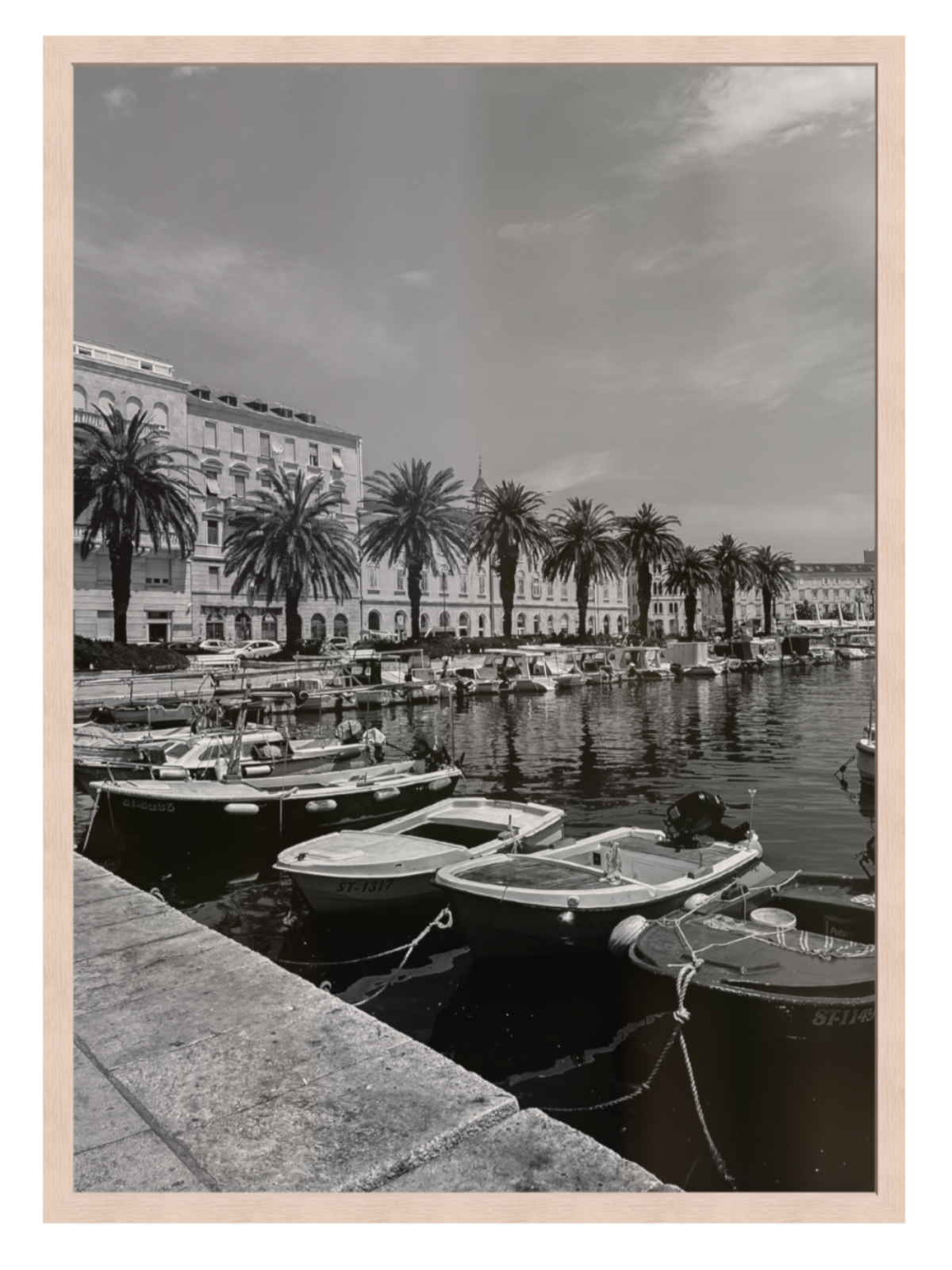 Harbor scene with boats and palm trees in a cityscape. Split boat light oak frame 