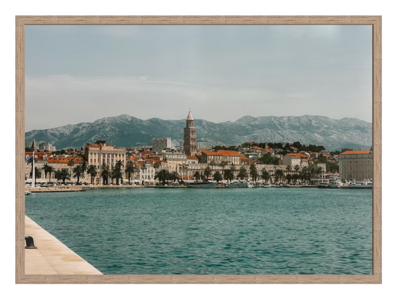 Cityscape with a prominent clock tower by a body of water, framed as a photograph.Split landscape hazel oak frame 