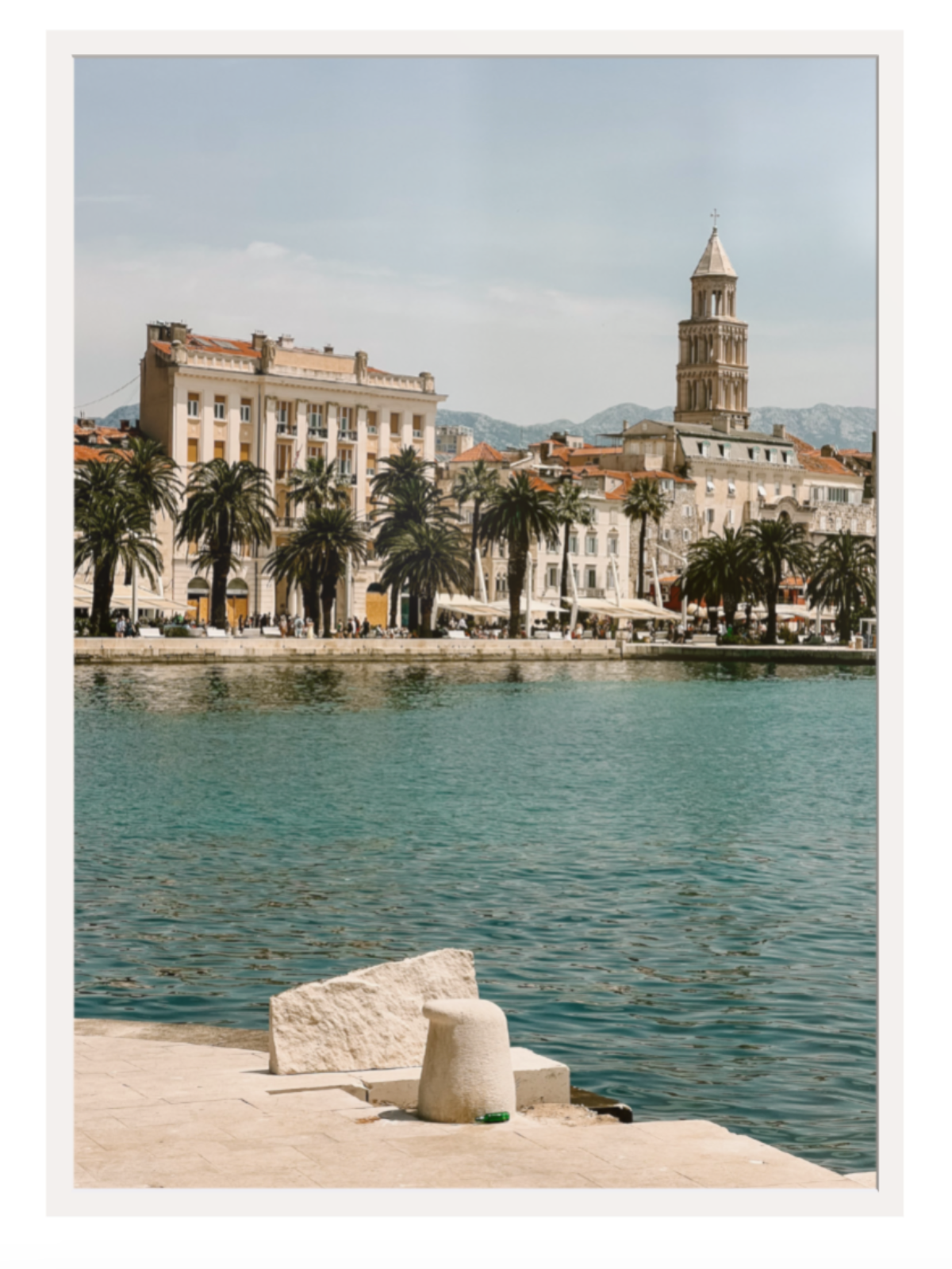 Cityscape with a clock tower by a waterfront on a sunny day Split white frame 