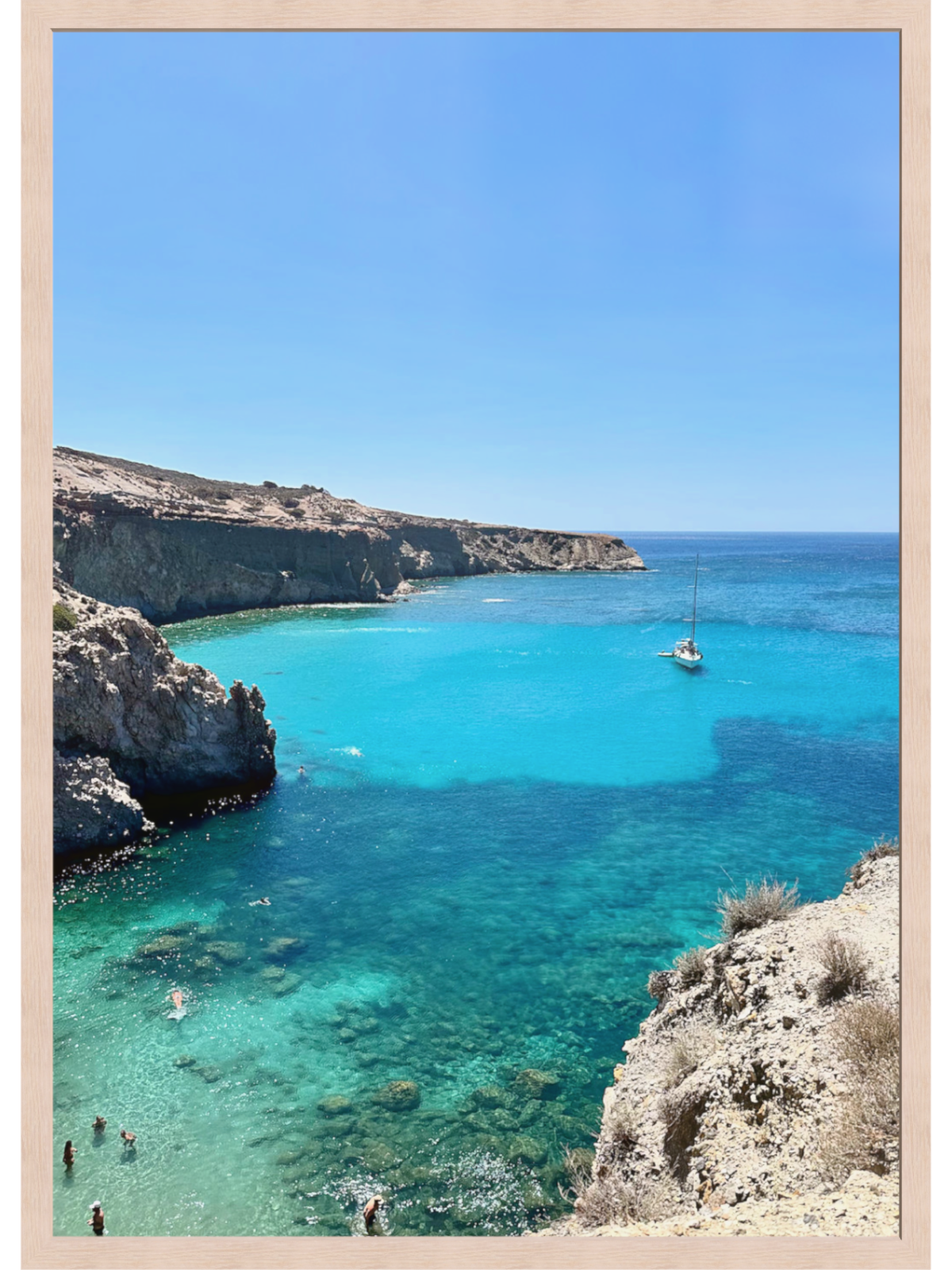 Turquoise sea with cliffs and a clear blue sky