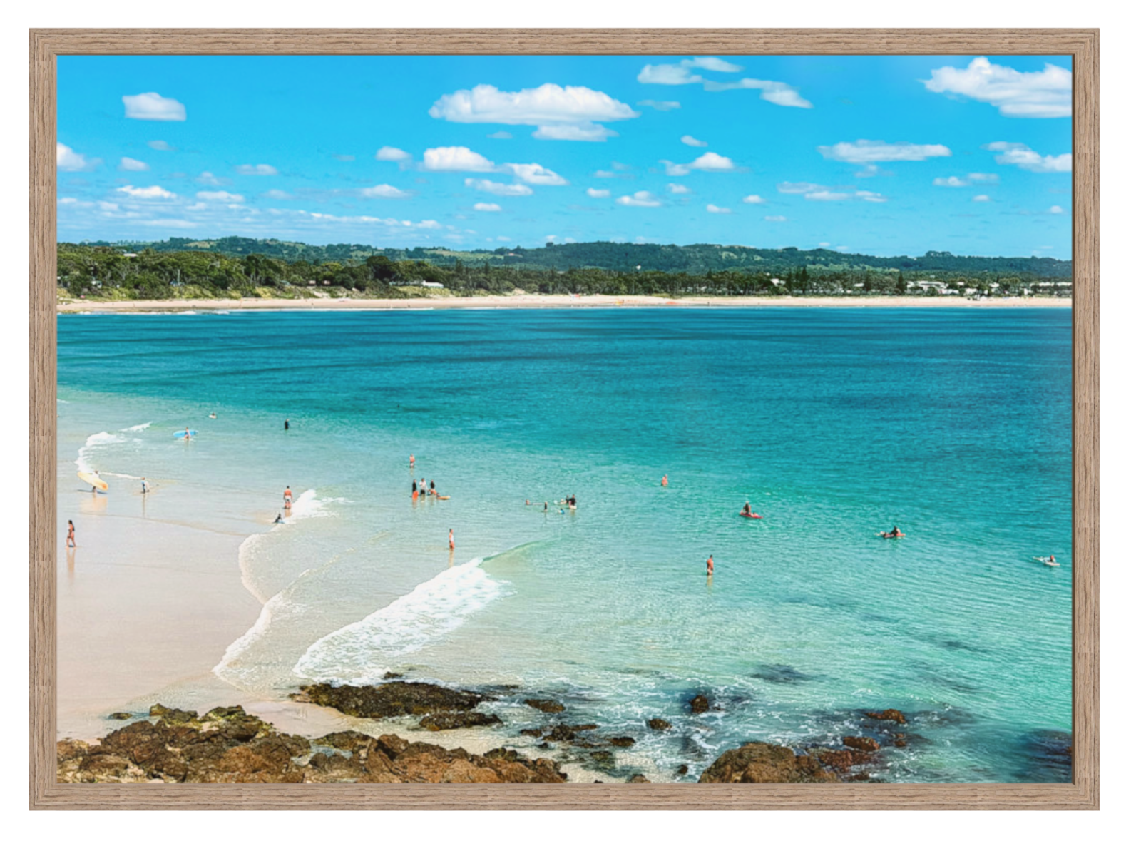 Beach scene with clear blue water and a wooden frame