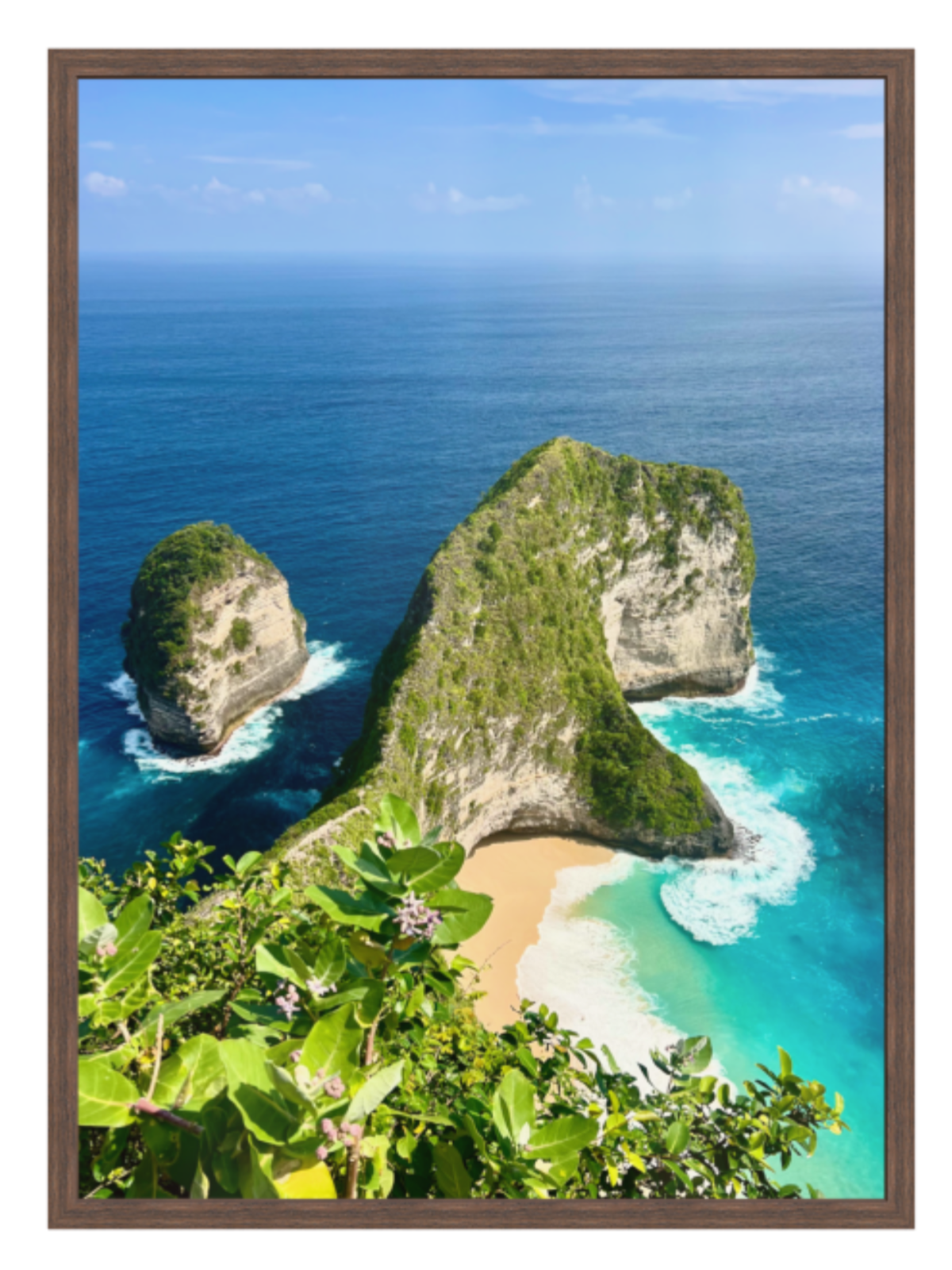 Vibrant coastal scene with cliffs and a beach, framed in brown.