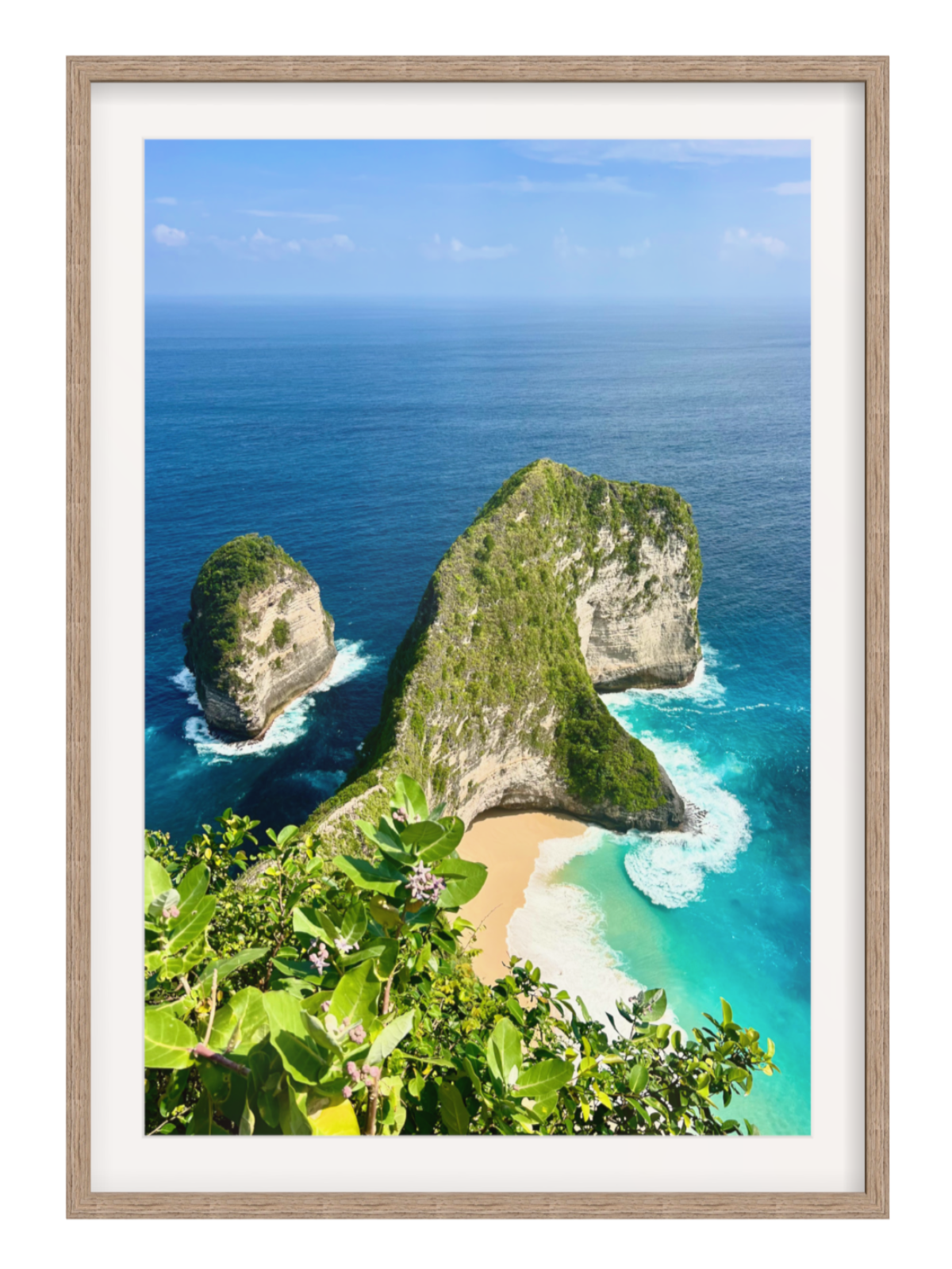Hazel with border Framed photograph of a tropical beach with cliffs and clear blue water.