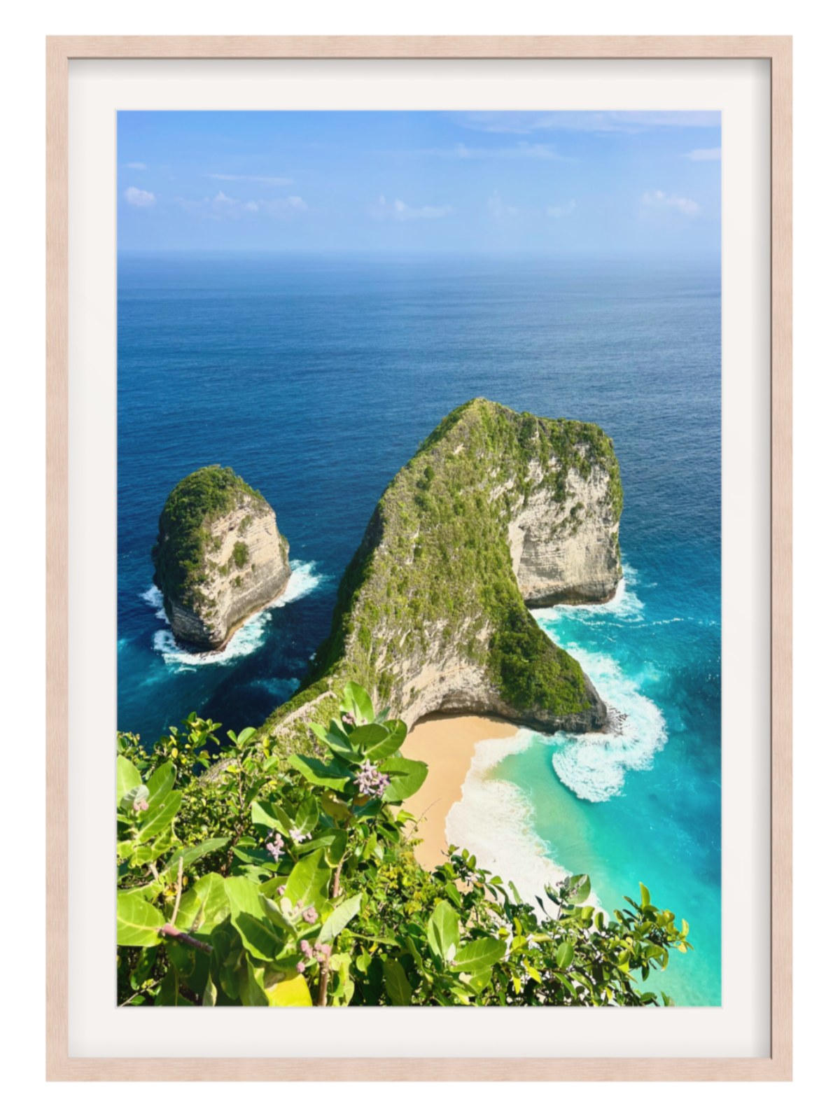 light oak with border Framed photograph of a tropical beach with cliffs and clear blue water.