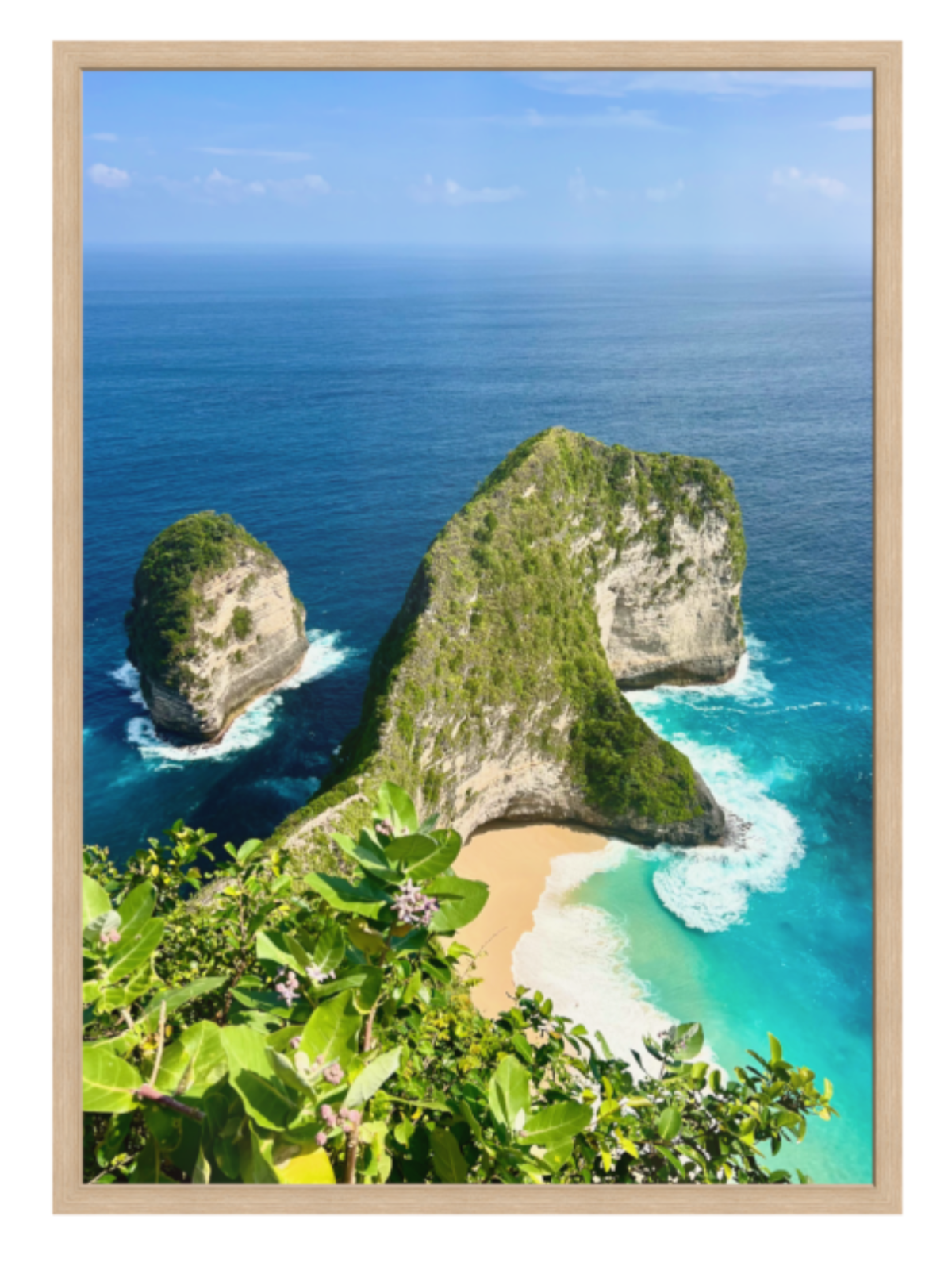 oak Framed artwork of a tropical landscape with cliffs and turquoise water.